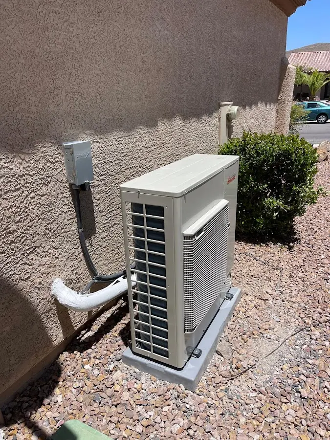 Residential air conditioning condenser unit in Harrison